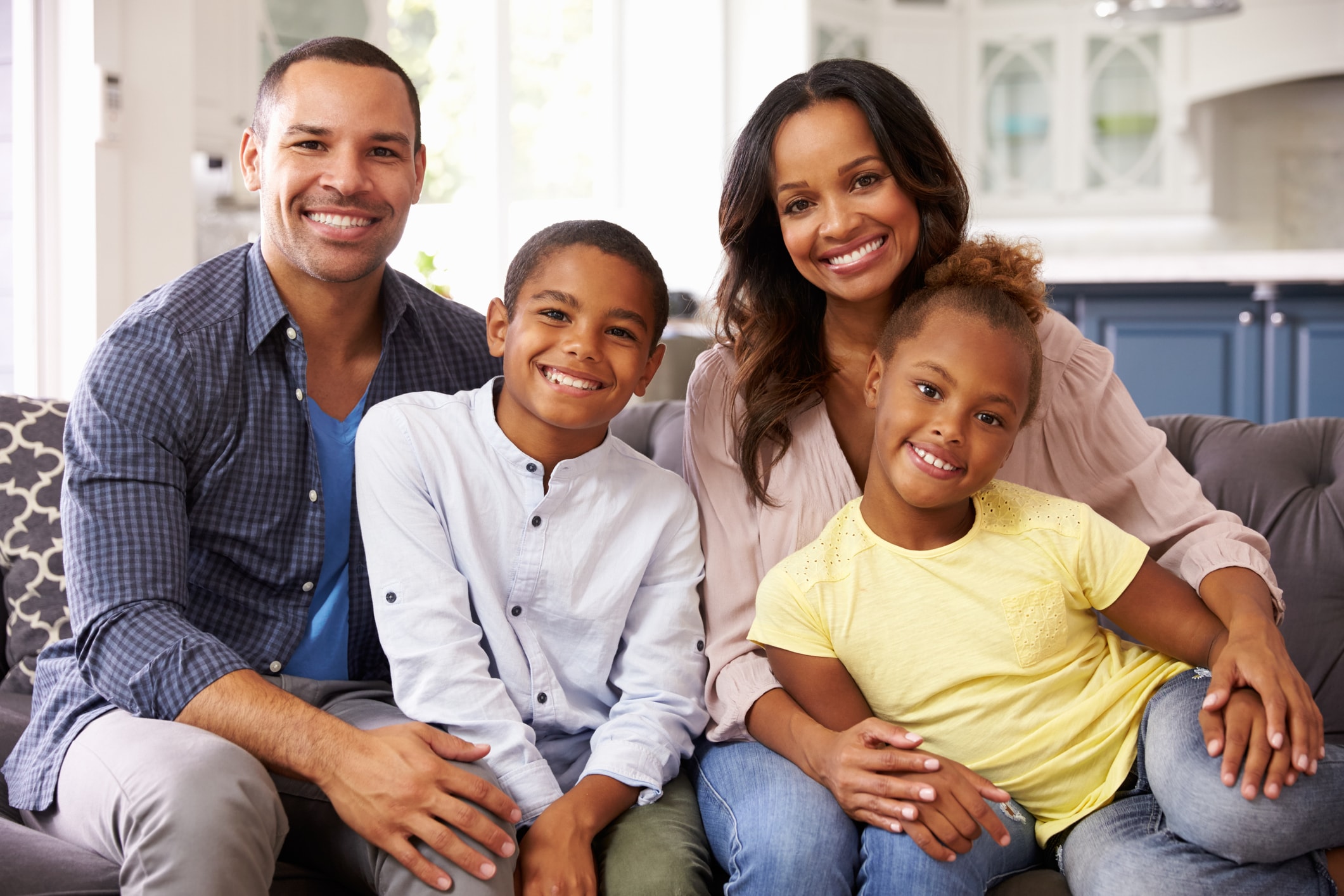 Family portrait smiling together at home