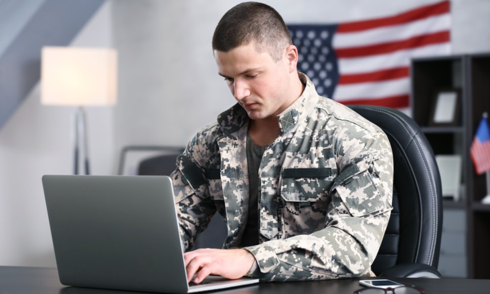 Military service member on laptop