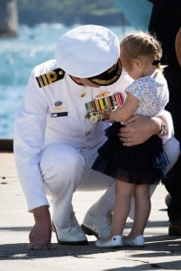 Navy officer with young child